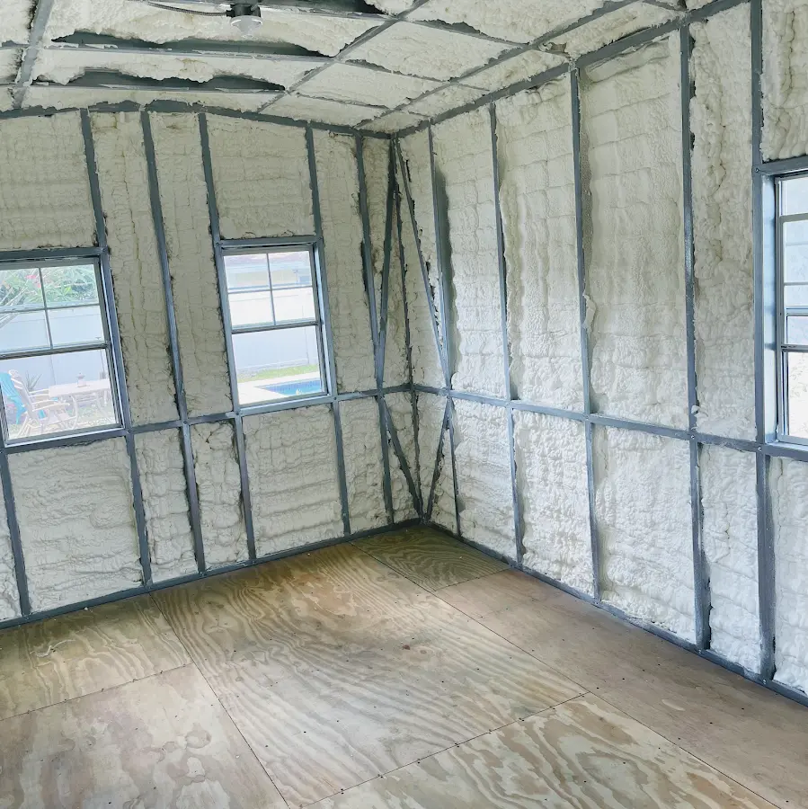 Closed-cell spray foam insulation applied to wall cavities in a residential project in Coal City